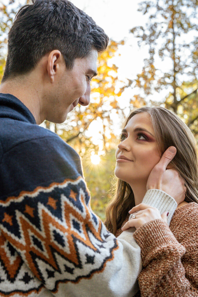 A couple looking into each others eyes during a sunset engagement session at Inniswoods Metro Garden in Westerville, Ohio.